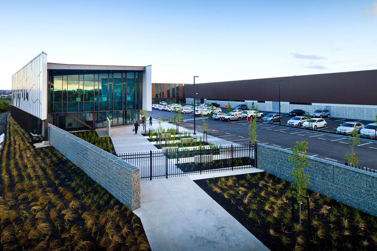 Exterior of the MPI Hub Auckland facility with landscaped entrance and car park